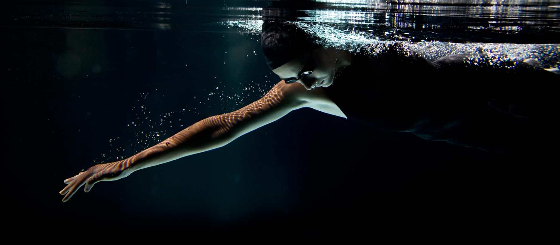 Person Swimming in a Pool