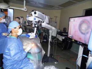 (Dr, William Trattler viewing surgery with goggles)