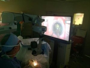 (Dr. Buznego viewing surgery with goggles)