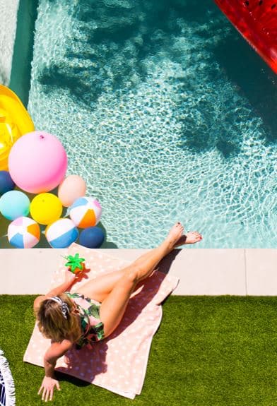 Woman sitting poolside